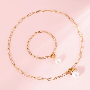 Elegant gold paperclip link necklace and bracelet set with white pearl T-bar closure