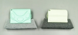 Detail of crevice cleaning brush with thick scouring pad head and ergonomic plastic handle