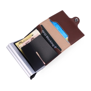 Detail view of brown PU leather RFID wallet with dual aluminum pop-up card holders