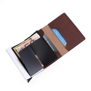 Detail of slim RFID blocking brown leather wallet with automatic pop-up aluminum card case