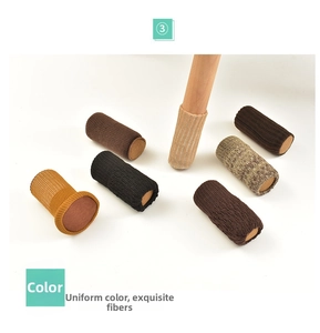 Close-up of thick knitted chair leg protectors in multiple colors with felt bottom pads