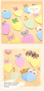 Flat lay of diverse heart-shaped cartoon animal sticky notes in pastel colors