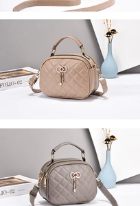 Detail of quilted leather texture and crystal butterfly tassel on elegant handbag
