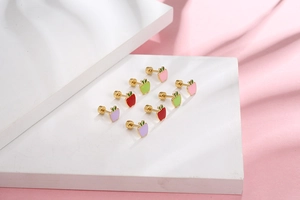Detail of colorful mini apple stud earrings in red, pink, green, and purple enamel colors