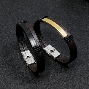 Detail of leather bracelets with stainless steel clasps in gold and black finishes