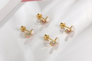 Macro shot of titanium steel rainbow cloud stud earrings with secure screw-back design