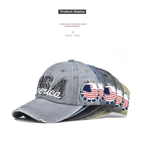 Detail of 1964 America embroidery and American flag patch on washed cotton baseball caps