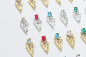 Detailed view of hollow triangle 3D nail art jewels with pear cut gemstones
