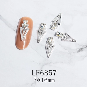 Macro view of 7x16mm hollow triangle nail art charms with crystal water drop stones
