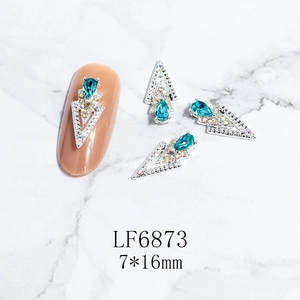 Detailed view of blue teardrop crystal alloy nail charm with 3D geometric design
