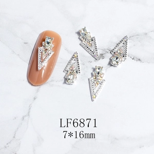 Detail of 3D alloy nail charms featuring teardrop rhinestones and 7x16mm silver base