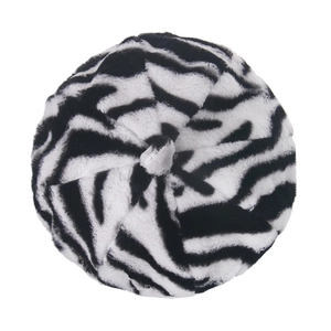 Top view of plush zebra print beret hat featuring soft faux fur texture and round top button