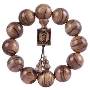 Authentic Vietnam agarwood prayer beads bracelet with engraved wood plaque on white background