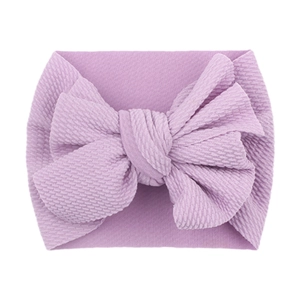 Soft purple baby headband featuring a large textured bow for infant girls