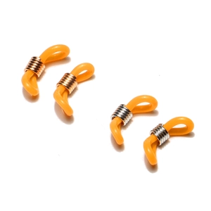 Detail of yellow silicone eyeglass chain loops with gold and silver metal coils