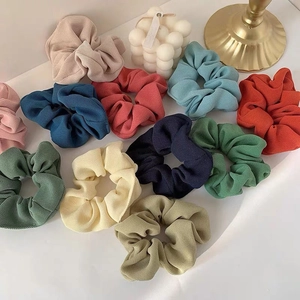Detail of colorful twill fabric scrunchies with soft ribbed texture and high elasticity
