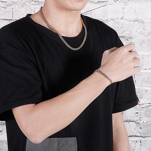 Two-tone curb link chain necklace and bracelet set in gold and silver finish for men