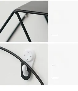 Detail of matte black iron wall shelf featuring sturdy welds and mountain shape design