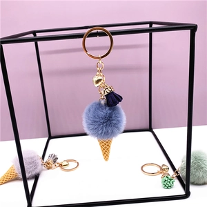 Cute plush ice cream keychain with colorful faux fur pompom and golden heart charm