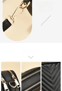 Close-up of black quilted leather crossbody bag with golden hardware and double zippers