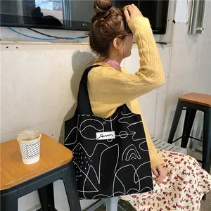Canvas tote bag with black and white abstract illustration and spacious design