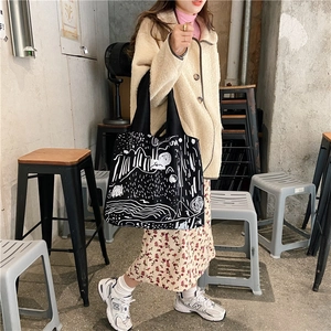 Canvas tote bag featuring white abstract mountain graffiti and a street style shoulder strap