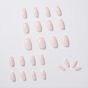 Glossy nude jelly French tip press-on nails in oval shape with white crescent accents