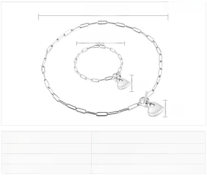 Detail showing paperclip chain necklace and bracelet set with heart charms and T-bar closure