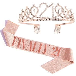 Macro detail of rose gold 21st birthday tiara and glitter sash with Finally 21 text