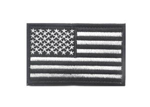 Close-up of black and silver USA flag patch with detailed high-quality embroidery