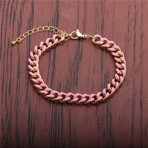 Close-up of pink enamel Cuban link bracelet with lobster clasp and adjustable chain