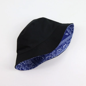 Detail showing the reversible design with black exterior and blue paisley pattern lining