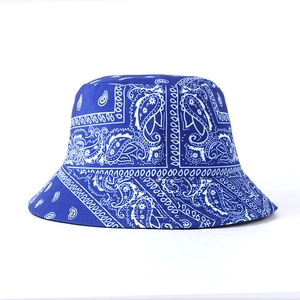 Detail of royal blue paisley bandana bucket hat with white pattern and stitch texture