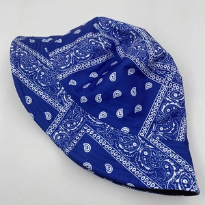 Close-up of blue paisley bucket hat showing detailed fabric texture and stitching details
