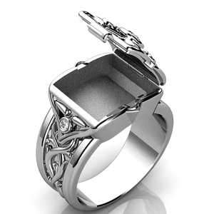 Detailed view of vintage silver poison ring with functional flip-top secret compartment