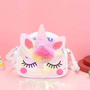 Close-up of holographic TPU unicorn crossbody bag with pink plush ball and white strap