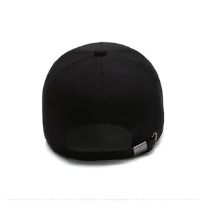 Rear view of black cotton baseball cap showing silver metal adjustable buckle on white background