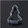 Close-up of a Christmas tree shaped metal cookie cutter on a sleek black surface