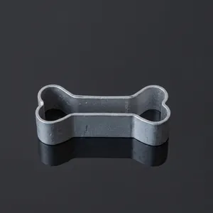 Macro detail of a grey bone-shaped cookie cutter mold with smooth edges