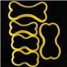 Detailed top view of five yellow dog bone shaped plastic cookie cutters in various sizes