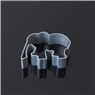 Close-up of elephant-shaped metal cookie cutter on dark reflective surface for DIY baking