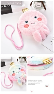 Detail of cute plush octopus crossbody bag with golden crown and pink braided shoulder strap