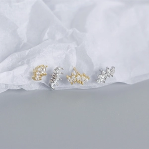 Macro shot of 925 sterling silver fan-shaped earrings with marquise-cut zircon stones