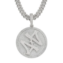 Close-up of silver iced-out Cuban chain and hip hop pendant with zircon inlay