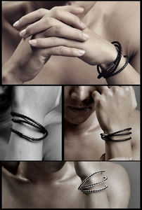 Detail of multi-layer braided leather bracelets for men with silver metal clasps