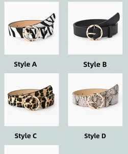 Detail view of four women belts with animal prints and golden round metal buckles