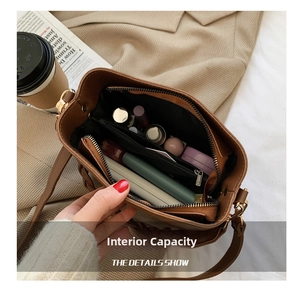 Top view showing the large interior capacity of this brown leather bucket crossbody bag