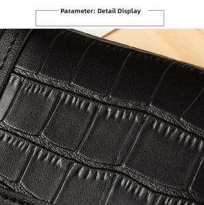 Detail showing high-quality black crocodile-patterned leather and precision stitching on card holder
