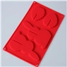 Detailed top view of 6-cavity red silicone mold with various pumpkin face shapes