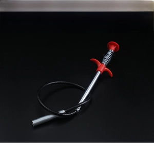 Flexible spring pipe unblocker tool with four-claw gripper shown in a coiled storage state